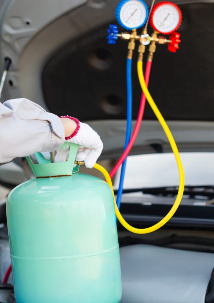 A car air con specialist at Motorvation Northampton re-gassing a car air con system.